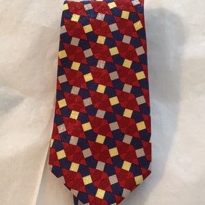 Tie silk red/blue/tan and yellow.